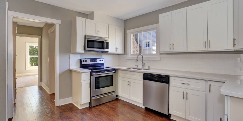 brand new kitchen with marble countertop and hardwood floor