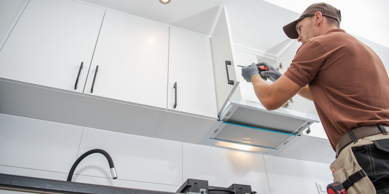 Maryland Kitchen Remodel contractor worker assembling of new apartment kitchen cabinets