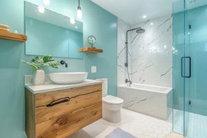 contemporary bathroom is designed with a stylish glass shower, warm wooden accents