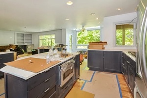partially finished kitchen remodel is a mess of boxes