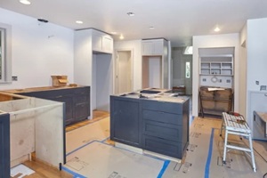 Custom cabinets for kitchen island, desk and counters are set in place