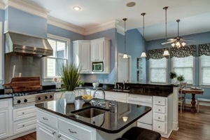 large american style kitchen and dining room interior with granite countertops