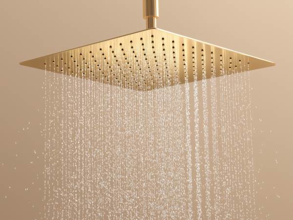 Modern square rainfall shower head with flowing water and a golden metallic finish, representing luxury bathroom fixtures, spa relaxation, and contemporary interior design