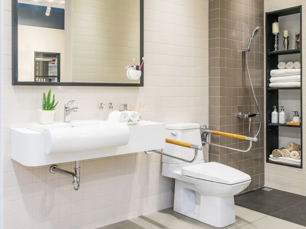 Interior of bathroom for the disabled or elderly people. Handrai