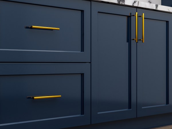 Navy blue kitchen cabinet doors and golden metal kitchen handles