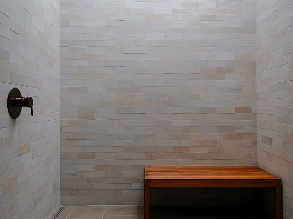 Modern minimalist shower with wooden bench and tiled walls