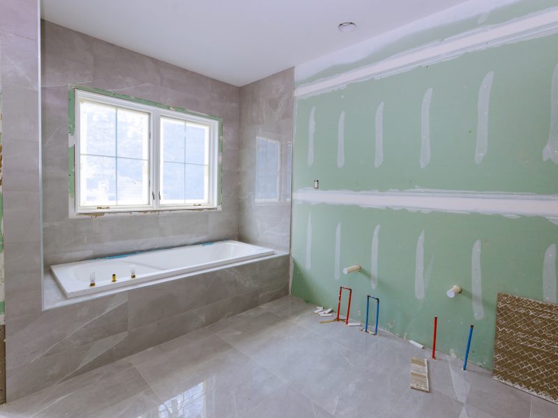 Under construction new bathtub remodeling a home bathroom, plumbing pipe system for new sinks