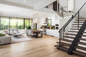 stylish spacious kitchen and living room with refrigerator and washing machine overlooking cozy dining area with wooden ceiling next to open balcony on sunny day