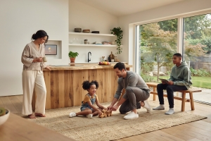 Family Playing in Modern Open Plan Kitchen and Living Room