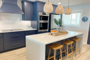 Newly Remodeled Modern Coastal Condo Kitchen Designed with Blue Cabinets